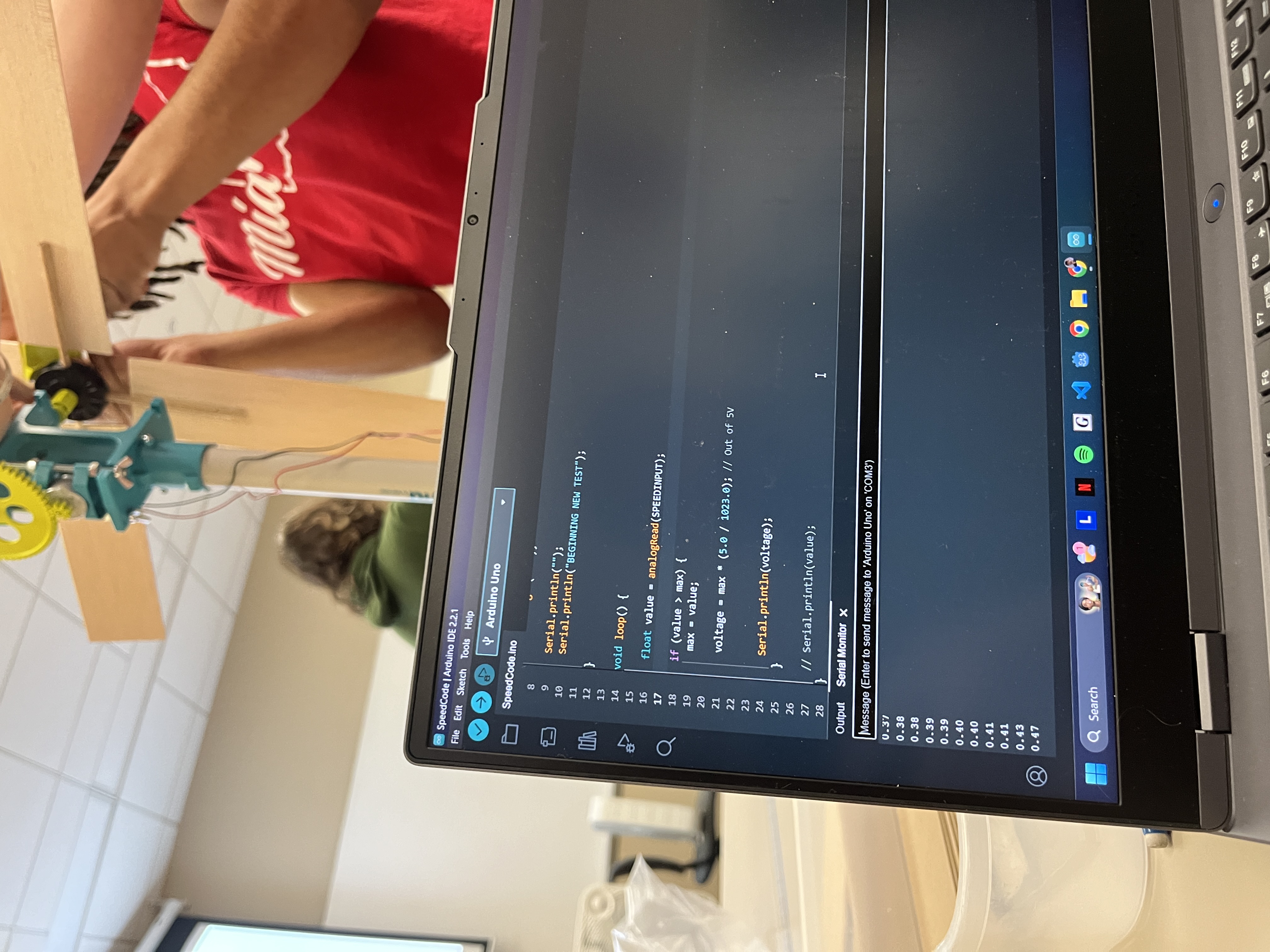 Our team using Arduino code to measure our turbine's power output